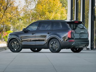 A black Kia Telluride parked