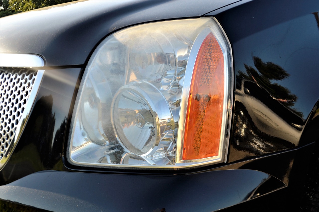 A headlight on a black car