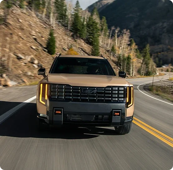 New Kia Telluride driving on a mountain highway