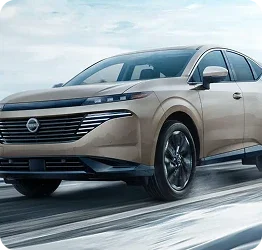 Used Nissan Murano driving on a snowy road